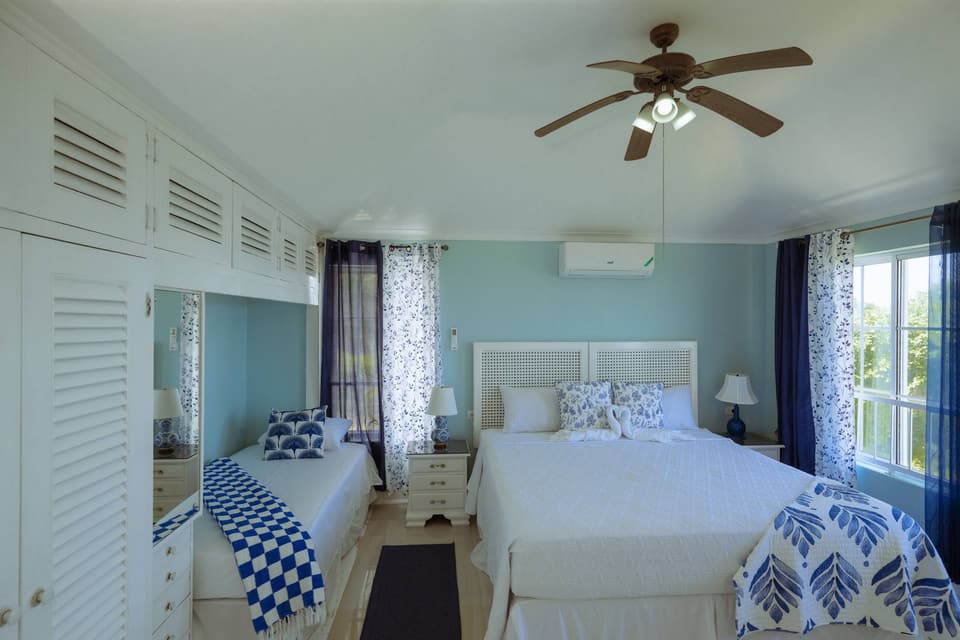 Blue Serenity at Bay Vista Villa, with a king bed and a single bed in blue and white