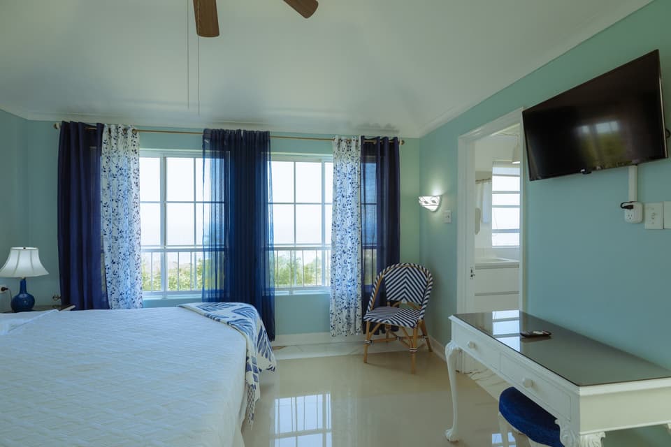 Blue Serenity at Bay Vista Villa with its television and desk