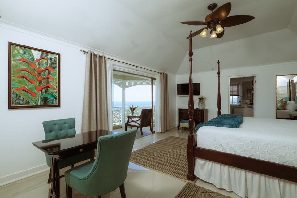 The writing desk and armchairs in the primary suite at Bay Vista Villa