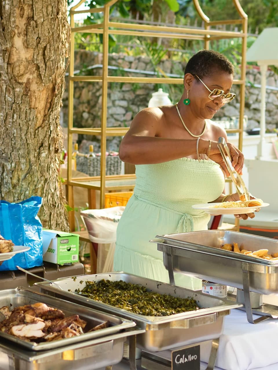 A Jamaican buffet being served on the deck at Bay Vista Villa
