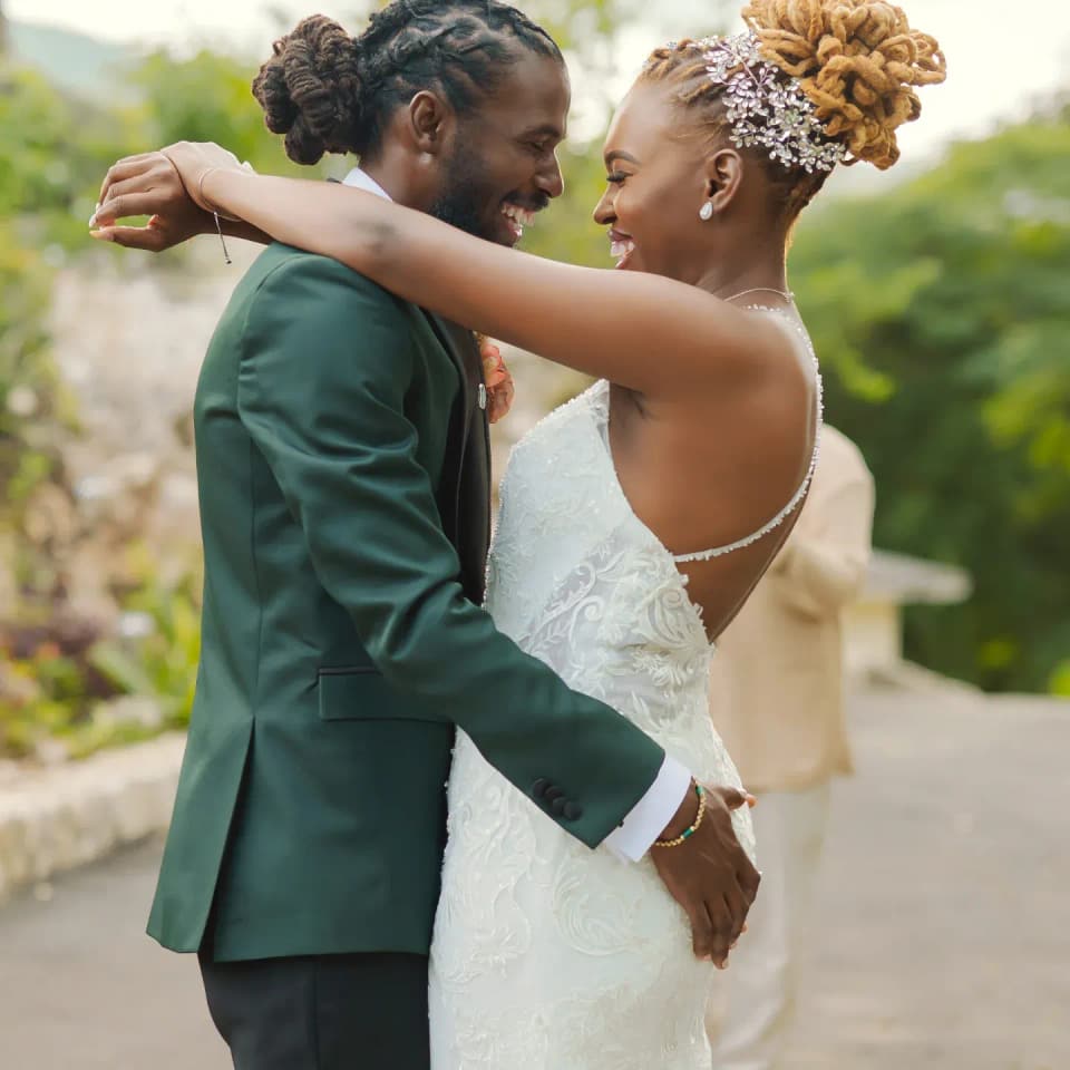 A couple's first look in the gardens at Bay Vista Villa
