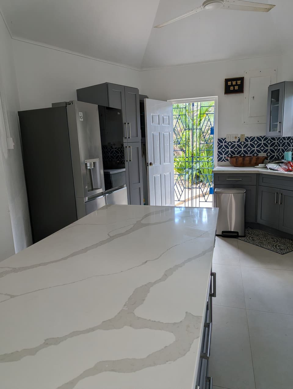 The kitchen at Bay Vista Villa with the door open to the garden